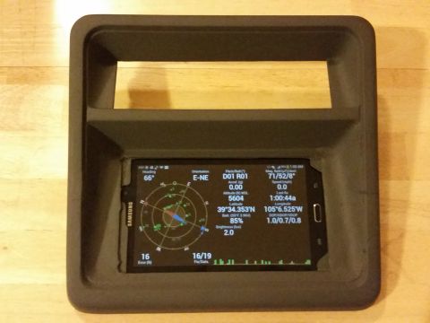 1988 Ford Bronco - A Samsung smartphone is mounted in a dashboard housing, showing GPS and navigation data.