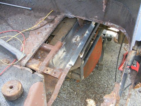 1978 Ford Bronco - The interior floor pan and frame show significant rust and damage, with exposed metal and wiring visible.