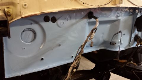 1978 Ford Bronco - Firewall area of a vehicle undergoing restoration, showing exposed metal and wiring.