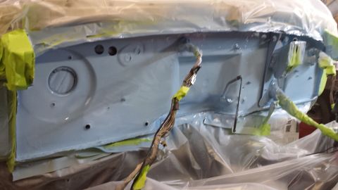1978 Ford Bronco - Engine bay is being prepped and painted, covered in protective plastic and tape.