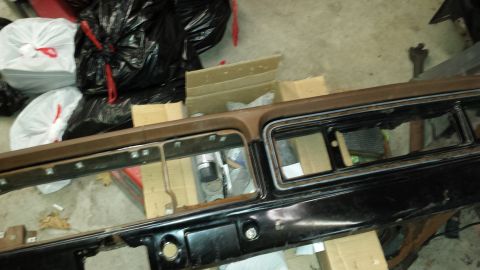 1978 Ford Bronco - Dashboard trim piece with openings for gauges, likely from an older vehicle.