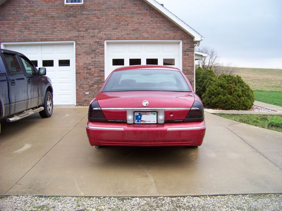 Red 1999 Mercury Grand Marquis rear view