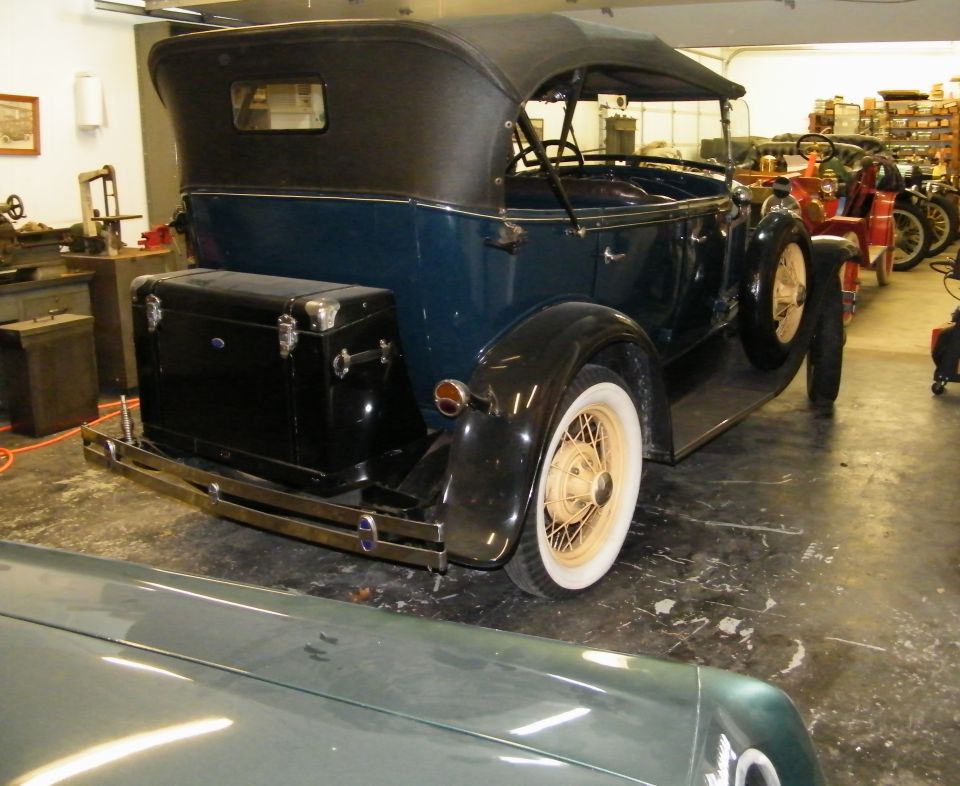1931 Ford Model A Phaeton with a trunk mounted on the rear bumper