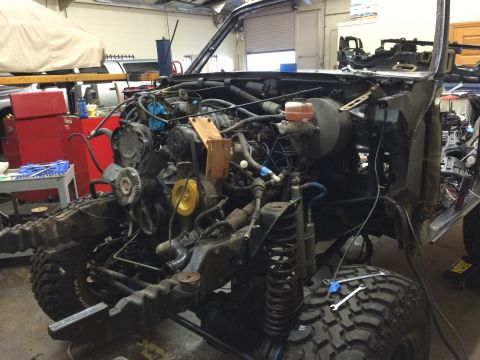 1992 Ford Bronco - The 1992 Ford Bronco is shown with its engine and chassis disassembled for maintenance.