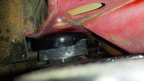 1991 Buick Reatta - Underside view of a car's suspension bushing.