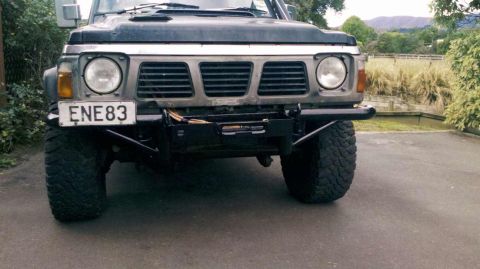 1989 Nissan Patrol - Front view of a 1989 Nissan Patrol equipped with a bull bar and winch.
