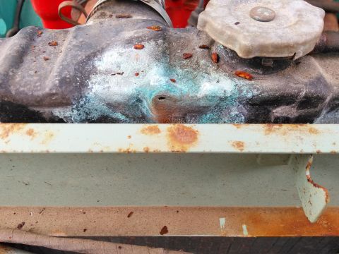 1991 Ford Bronco - The radiator cap and top tank show significant corrosion and rust.