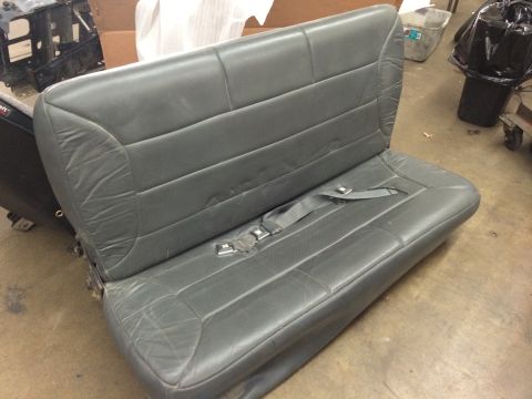 1992 Ford Bronco - A gray leather rear seat with seatbelts is shown, likely a replacement part.