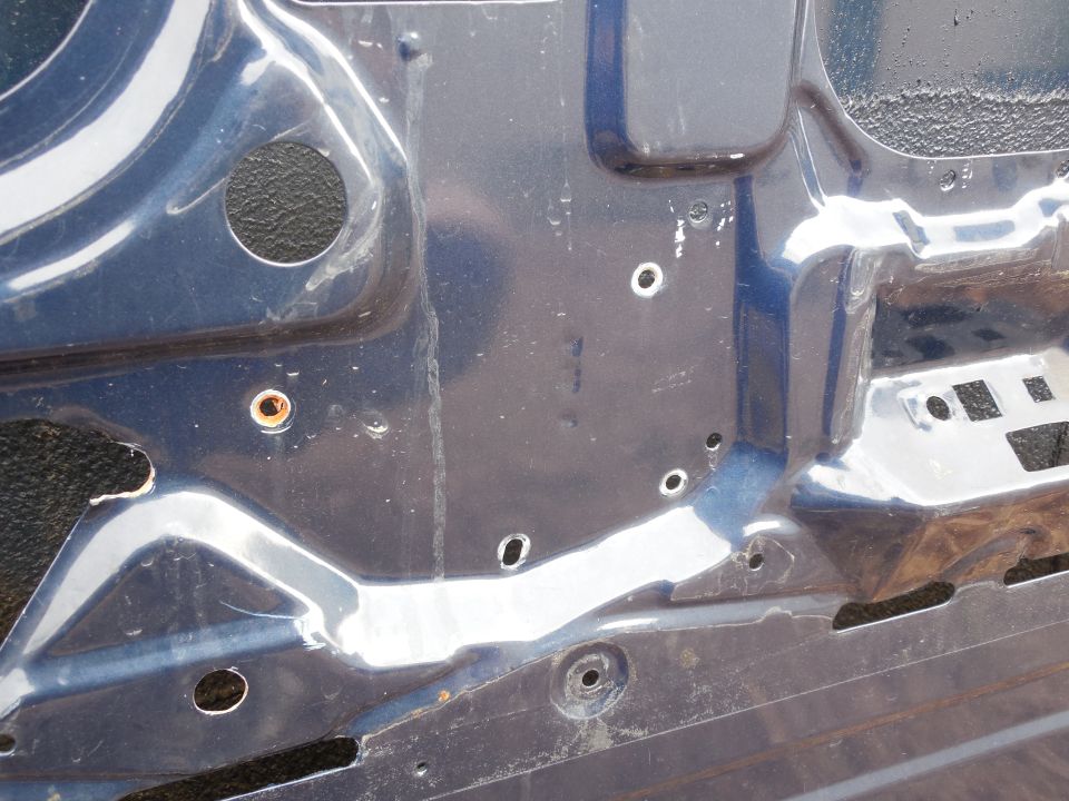 Door inner skin date stamp '93EB : 6 23 7

The rough-edged slot  and drilled hole near the bottom Left of the pic are to access the window motor's bolts.