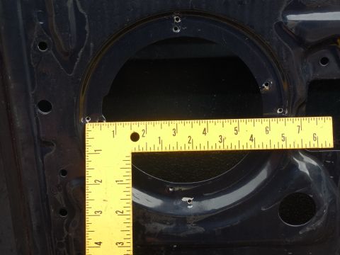 1983 Ford Bronco - Door speaker well '93EB : ~6 3/8" The non-factory screw holes are very close to the edge of the speaker well.