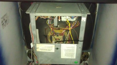 2006 Honda RANCHER - The internal components and wiring of a machine are visible, including circuit boards and various labels.