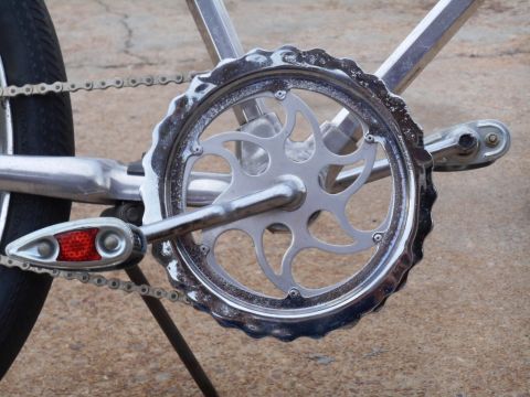 Chrome bicycle crankset with chain and reflector