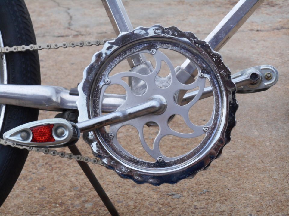 Chrome bicycle crankset with chain and reflector
