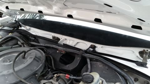 1991 Ford LTD Crown Victoria - Close-up view of various engine bay components and wiring harnesses.
