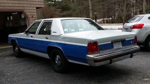1991 Ford LTD Crown Victoria - Rear view of a 1991 Ford Crown Victoria LTD, showing its two-tone paint scheme and license plate.