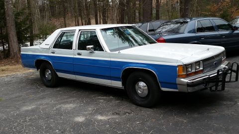 1991 Ford LTD Crown Victoria - This 1991 Ford Crown Victoria LTD features a distinctive two-tone paint scheme and a front push bar.