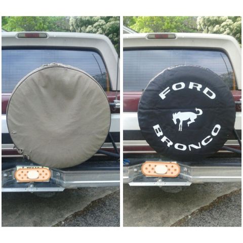 1996 Ford Bronco - The spare tire cover on this 1996 Ford Bronco clearly displays the iconic Ford Bronco emblem and lettering.