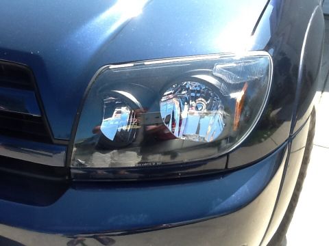 2005 Toyota 4Runner - Close-up of the headlight assembly on a 2005 Toyota 4Runner.