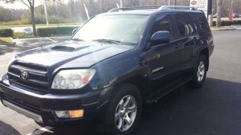 2005 Toyota 4Runner - The front passenger side of a dark blue Toyota 4Runner is visible in this photo.