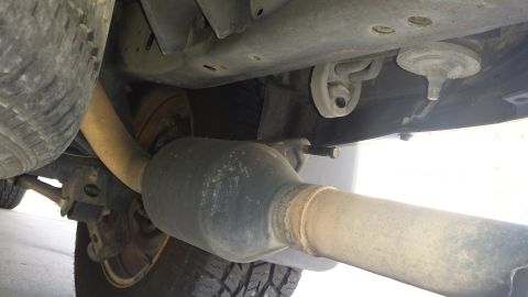 2005 Toyota 4Runner - Close-up of the undercarriage, focusing on the exhaust pipe and spare tire assembly.