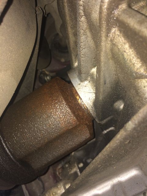 2011 Ford Elite - This image shows a close-up view of a CV shaft and seal, appearing to be covered in grease and rust.