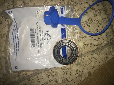 2011 Ford Elite - A Ford CV shaft seal kit is shown, including a seal and a blue installation tool.