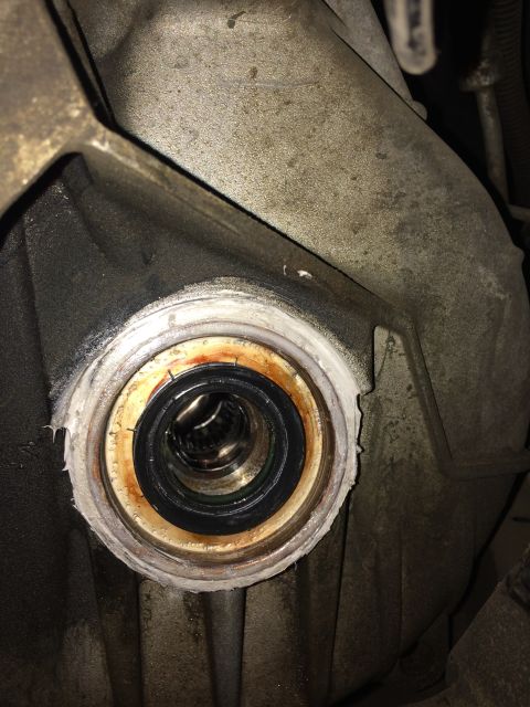 2011 Ford Elite - A close-up view of a CV shaft seal, likely needing replacement.