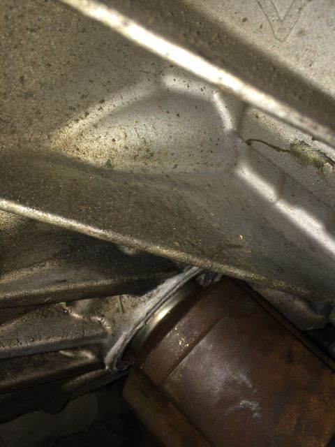 2011 Ford Elite - Close-up view of a CV shaft seal, showing grease and grime accumulation around the component.