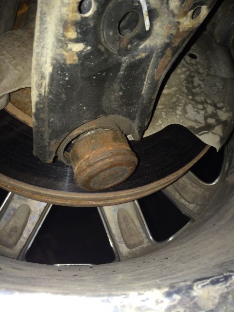 2011 Ford Elite - Close-up view of a vehicle's right-hand ball joint in a downward position.