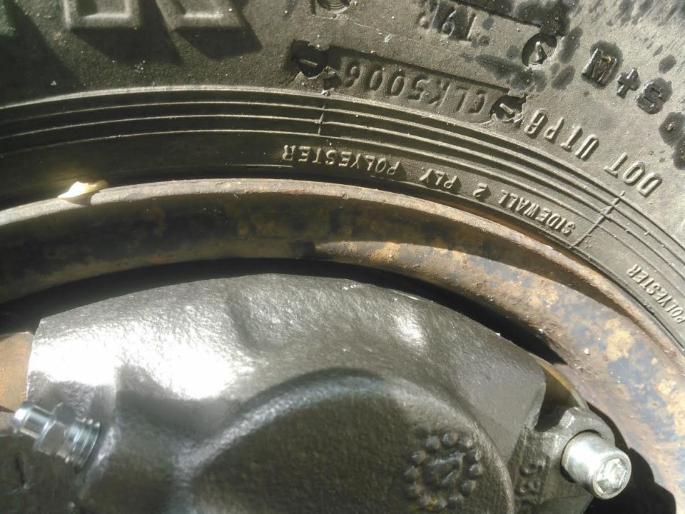 checking clearance on a 15 inch wheel. it was close in some spots but cleared. defiantly want to make sure to use a disc brake adapter for a 1/2 ton axle that uses smaller brakes. I wouldn't be surprised if I find some scrapes on the rim next time I pull it off