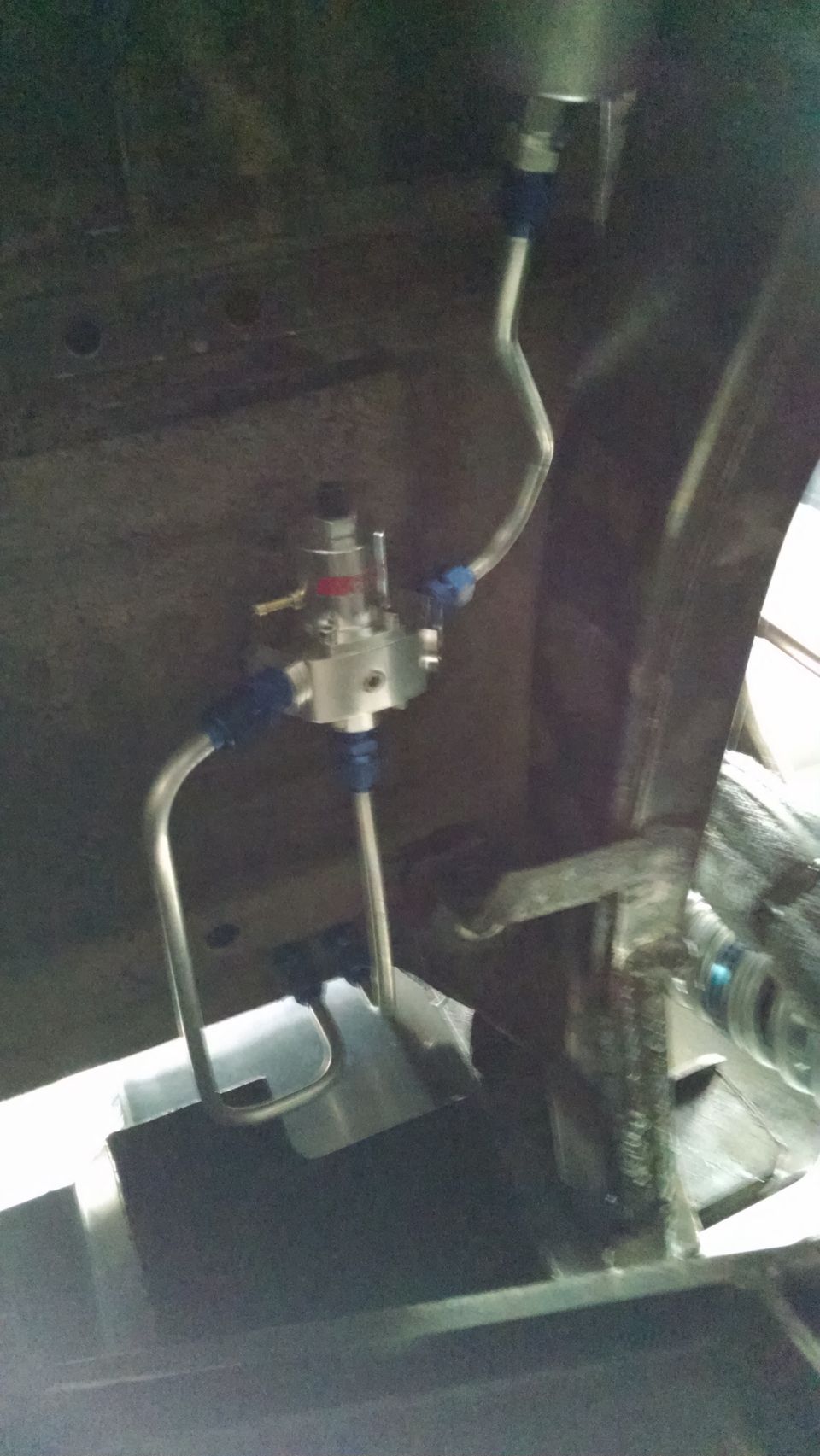fuel pressure regulator with blue fittings and metal lines