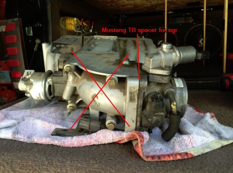 1993 Ford Bronco - An engine intake manifold is shown with markings indicating a throttle body spacer for the EGR system.