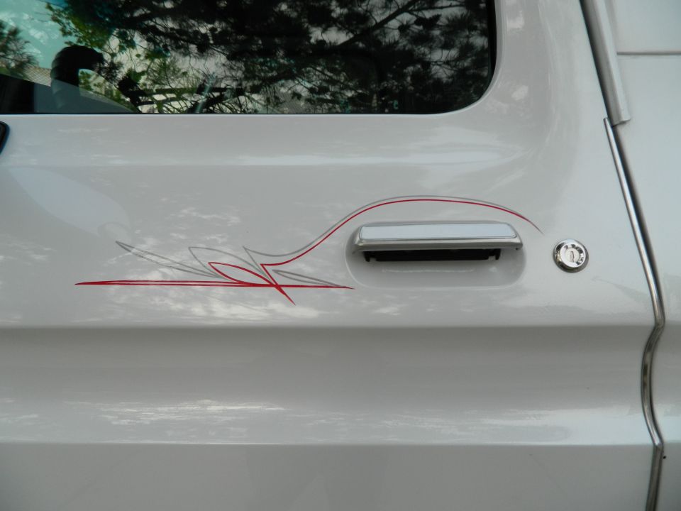 1979 Ford Bronco door with pinstripe graphics and chrome handle