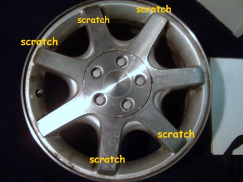 1997 Ford Taurus - people at sears scraped up all my rims cause we took tires back!! and they did it on purpose.