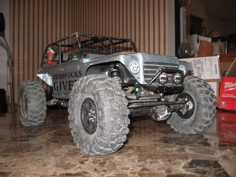 1993 Toyota 4Runner - This remote control rock crawler toy has a custom roll cage and large off-road tires.