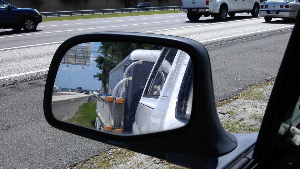 On the side of 295, Plan A was to tie the axle up to take weight off the affected tire, but I had no ratcheting tie downs.
Since it's a dual axle trailer plan B was to keep going, if the tire shreds then so be it.