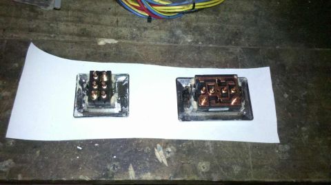 1982 Ford Bronco - Two automotive electrical connectors are shown side-by-side on a workbench.