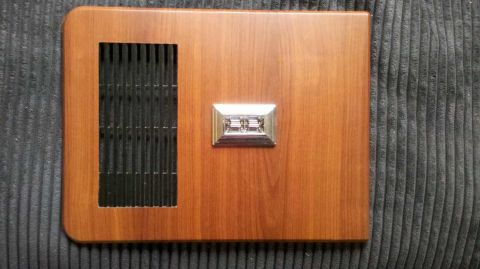 1982 Ford Bronco - Door trim panel with vent and window crank, likely from an older vehicle.