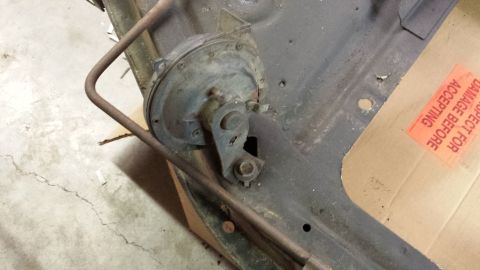 1978 Ford Bronco - Close-up of a horn assembly mounted on a metal frame, with a SuperMotors logo visible at the bottom right.