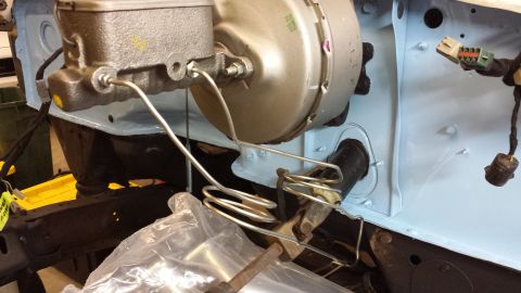 1978 Ford Bronco - Close-up view of the brake booster and master cylinder assembly.