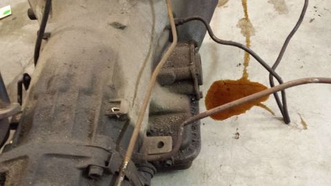 1978 Ford Bronco - Transmission showing signs of an oil leak on the floor.