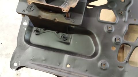 1978 Ford Bronco - This is a close-up view of a metal car part, likely from the interior or undercarriage.