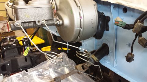 1978 Ford Bronco - Close-up view of the brake master cylinder and vacuum booster assembly, showing brake lines and wiring harnesses.