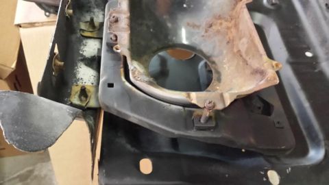 1978 Ford Bronco - Close-up of a rusted metal component, possibly from a vehicle, with a visible SuperMotors.net watermark.