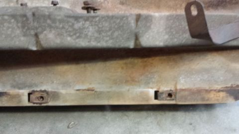 1978 Ford Bronco - This is a close-up view of a rusty metal component, possibly from a vehicle's undercarriage.