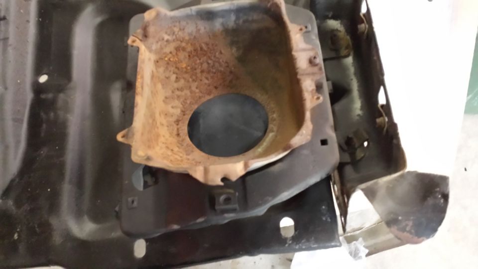 Rusted headlight bucket assembly with mounting brackets