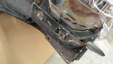 1978 Ford Bronco - Close-up of a corroded vehicle component, showing signs of wear and tear.