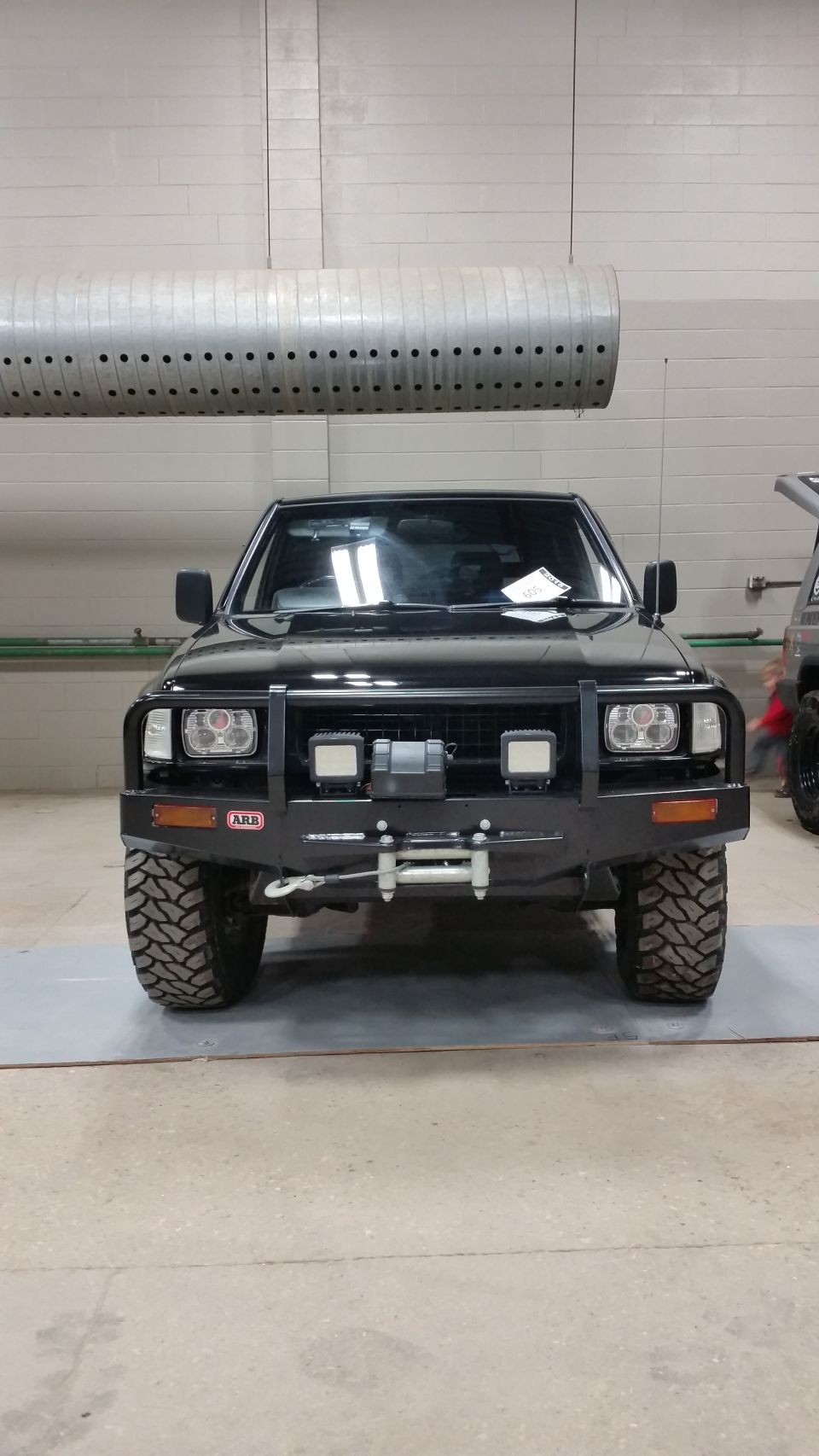 Black 1991 Isuzu Amigo front view with ARB bumper and winch