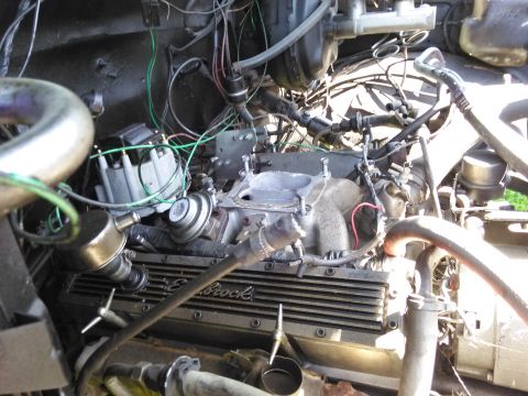 1991 Ford Bronco - Close-up view of a vehicle's engine bay, showing various components and wiring.