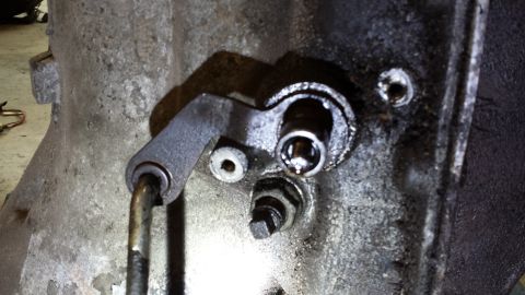 1978 Ford Bronco - A detailed view of a vehicle's transmission component, showing mechanical linkage and signs of wear.